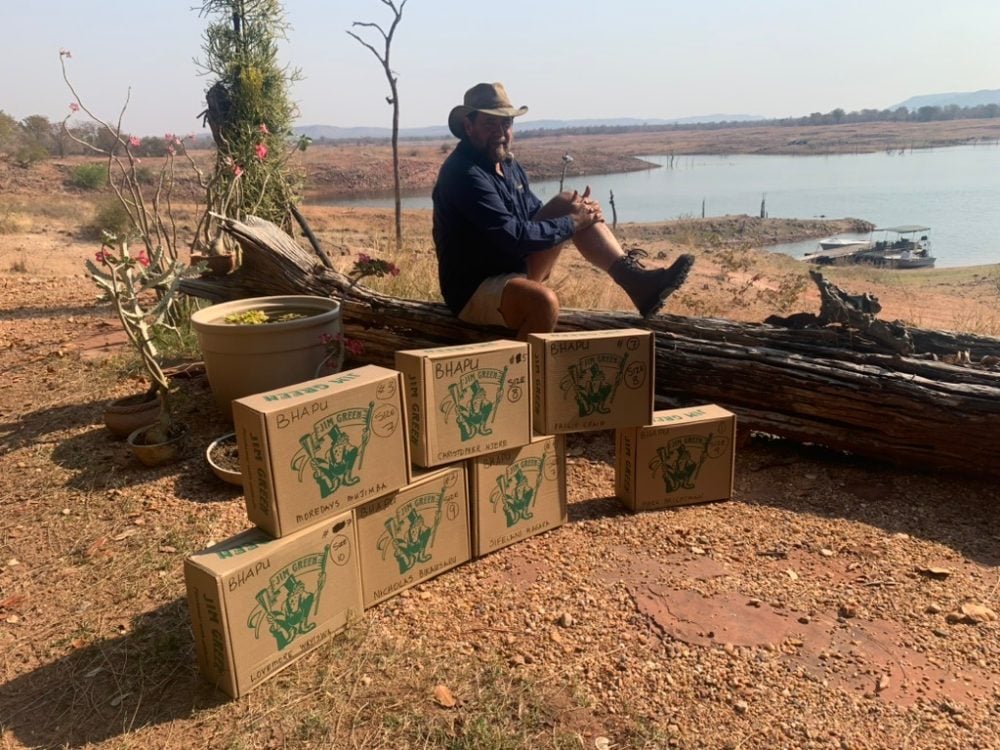 Rangers moving through jesse bush and riverine terrain in the Zambezi Valley
