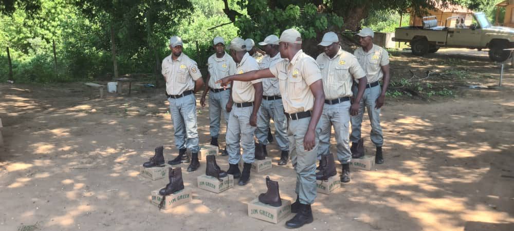 Rangers inspecting Jim Green boots on the ground