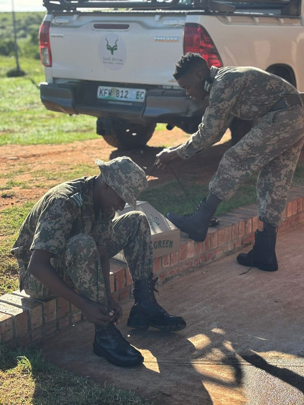 Ranger tying the laces of their new Jim Green boots
